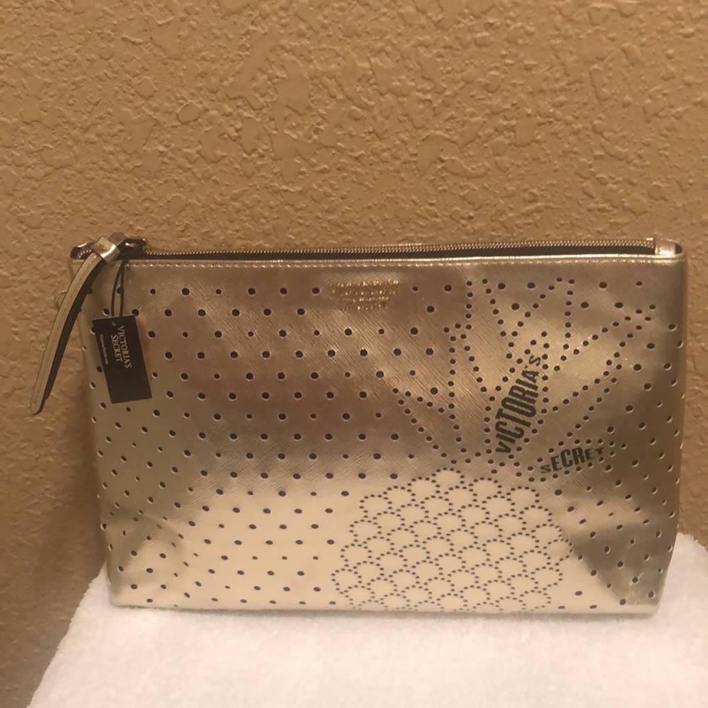 NWT Victoria’s Secret cosmetic bag.  Has cute pineapple design on the front.